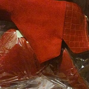 Brand new red heeled boot never worn size 10